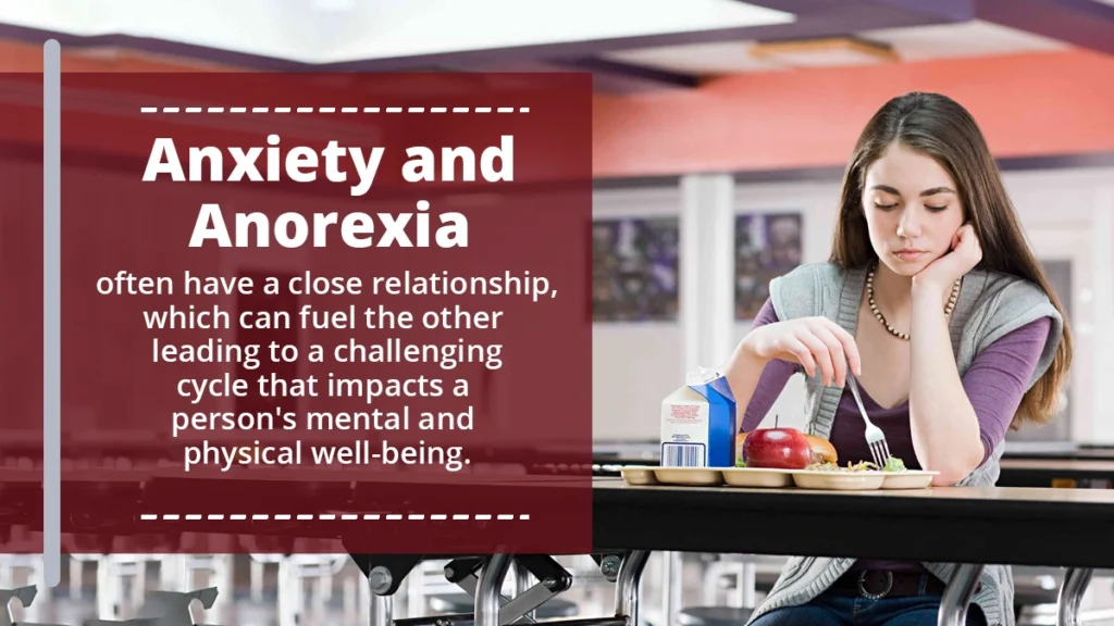 Teenage girl sitting in the school cafeteria, not eating her lunch. Anxiety and anorexia have a close relationship, often fueling each other